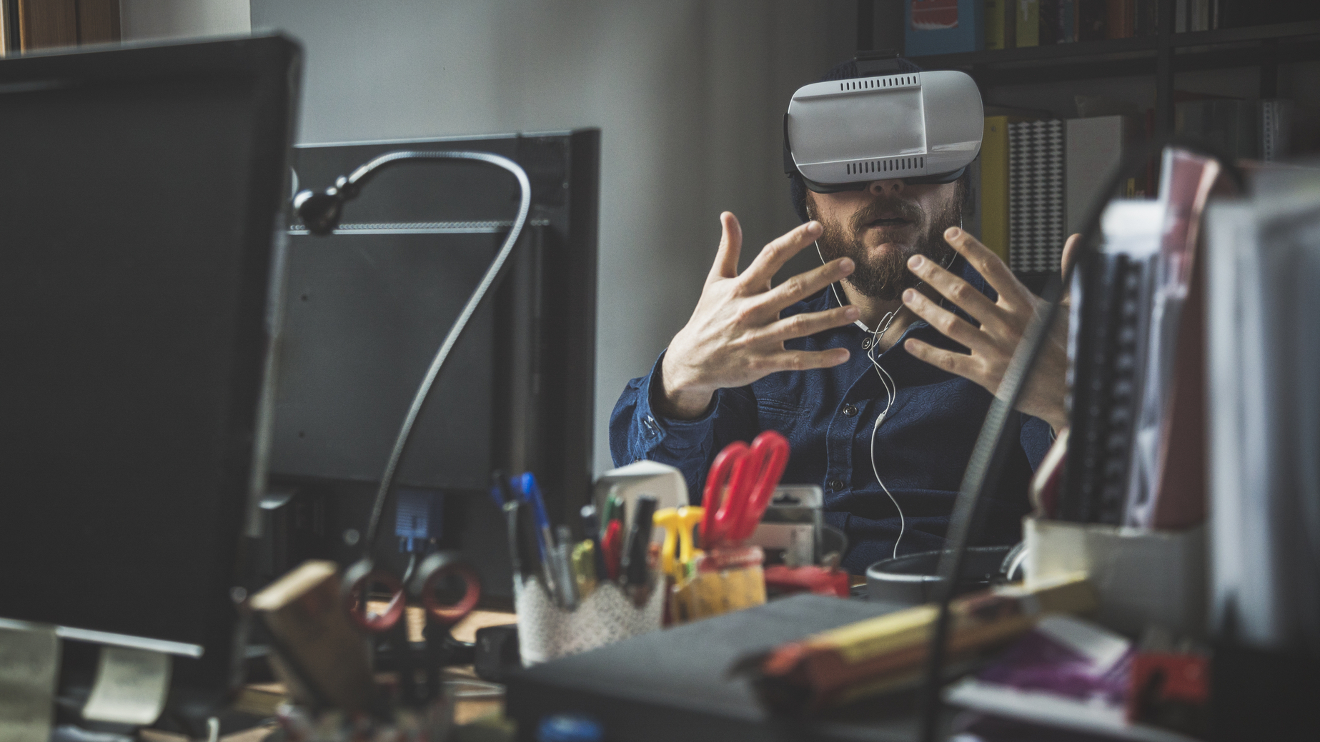 Man wearing virtual reality headset at the office